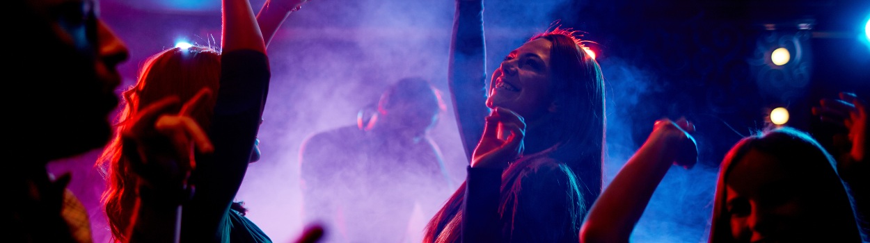 A group of people dancing in a nightclub